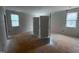 Bright bedroom featuring white walls, trim, and doors, awaiting finishing touches and flooring installation at 162 Gaines Trail, Pittsboro, NC 27312