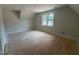 Large bedroom with a window providing natural light and a view to outside at 162 Gaines Trail, Pittsboro, NC 27312