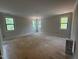 Spacious bedroom featuring three windows offering natural light and serene views at 162 Gaines Trail, Pittsboro, NC 27312