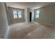 Bedroom showcasing a doorway and two windows providing natural light and views to outside at 162 Gaines Trail, Pittsboro, NC 27312