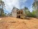 New construction home featuring an expansive yard and multiple wooden decks perfect for outdoor living and entertaining at 162 Gaines Trail, Pittsboro, NC 27312
