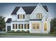 A grand two-story home features a brick and siding elevation and a welcoming front porch at 162 Gaines Trail, Pittsboro, NC 27312
