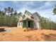 Exterior view of new home construction, featuring front porch at 162 Gaines Trail, Pittsboro, NC 27312