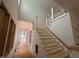 Foyer area of a home under construction, featuring an incomplete staircase at 162 Gaines Trail, Pittsboro, NC 27312