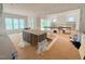 Unfinished kitchen with a center island, windows, and access to the living space at 162 Gaines Trail, Pittsboro, NC 27312