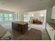 Spacious kitchen featuring a central island, ample counter space, and natural light from large windows at 162 Gaines Trail, Pittsboro, NC 27312