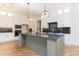 Spacious kitchen with a center island, granite countertops, and modern stainless steel appliances at 162 Gaines Trail, Pittsboro, NC 27312