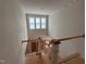 Second story landing area with staircase and windows under construction at 162 Gaines Trail, Pittsboro, NC 27312