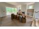 Bright living room with built-in shelves, a fireplace, and sliding glass doors to a deck at 162 Gaines Trail, Pittsboro, NC 27312