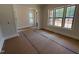Bright living room area with large windows and open space, offering ample natural light at 162 Gaines Trail, Pittsboro, NC 27312