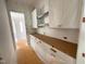 Butler's pantry featuring long countertop and white cabinets under construction at 162 Gaines Trail, Pittsboro, NC 27312