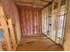 Unfinished room featuring pink insulation, wood framing, and rough plumbing at 162 Gaines Trail, Pittsboro, NC 27312