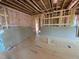 Unfinished room showing pink insulation and exposed wall framing at 162 Gaines Trail, Pittsboro, NC 27312