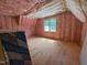 Unfinished bonus room showing framing, pink insulation, flooring, and windows at 162 Gaines Trail, Pittsboro, NC 27312