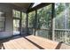 The screened porch boasts wood floors and provides a view of the surrounding trees at 162 Gaines Trail, Pittsboro, NC 27312
