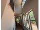 View of a staircase with large windows, and wood and iron railing at 162 Gaines Trail, Pittsboro, NC 27312