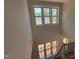 Staircase landing with large windows offering views of the surrounding area at 162 Gaines Trail, Pittsboro, NC 27312