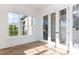 Sun-drenched sun room with hardwood floors, a window, and glass doors at 162 Gaines Trail, Pittsboro, NC 27312