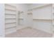 Walk-in closet featuring shelves and hanging rods at 162 Gaines Trail, Pittsboro, NC 27312