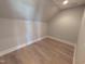 Spacious attic with hardwood floors, recessed lighting, and freshly painted neutral walls at 5812 Shawood Dr, Raleigh, NC 27609