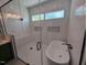 Bright bathroom with a glass shower and standalone tub at 5812 Shawood Dr, Raleigh, NC 27609