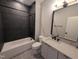 Bathroom featuring a tub and shower combo with a contemporary vanity at 5812 Shawood Dr, Raleigh, NC 27609