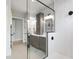 Modern bathroom featuring a frameless shower with black hardware and decorative tile at 5812 Shawood Dr, Raleigh, NC 27609