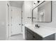 Modern bathroom with dark cabinets, quartz countertop, and black hardware at 5812 Shawood Dr, Raleigh, NC 27609