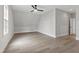Bright bedroom with vaulted ceiling, hardwood floors, fan, and large window at 5812 Shawood Dr, Raleigh, NC 27609