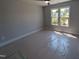Sunlit bedroom with large window at 5812 Shawood Dr, Raleigh, NC 27609