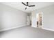 Bedroom with carpet, ceiling fan, and ensuite bathroom and closet at 5812 Shawood Dr, Raleigh, NC 27609