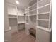 Large walk-in closet with custom shelving and drawers at 5812 Shawood Dr, Raleigh, NC 27609
