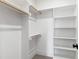 Spacious walk-in closet features wood dowels and adjustable shelving units at 5812 Shawood Dr, Raleigh, NC 27609