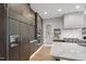 Modern kitchen boasts custom cabinets, high-end appliances, and a clean, minimalist design at 5812 Shawood Dr, Raleigh, NC 27609