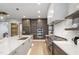 Well-equipped kitchen with a large island, modern fixtures, and professional-grade appliances at 5812 Shawood Dr, Raleigh, NC 27609