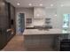Modern kitchen featuring an island, contemporary finishes, and bright lighting at 5812 Shawood Dr, Raleigh, NC 27609