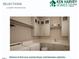 Bright laundry room with washer, dryer, cabinets, and shelves at 5812 Shawood Dr, Raleigh, NC 27609