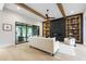 Inviting living room with a stylish fireplace, custom built-ins, and sliding glass doors leading to the backyard at 5812 Shawood Dr, Raleigh, NC 27609