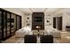 Cozy living room with a fireplace, a sleek TV, and built-in shelving at 5812 Shawood Dr, Raleigh, NC 27609