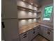 Bright home office featuring custom built-ins, natural light, and contemporary finishes at 5812 Shawood Dr, Raleigh, NC 27609