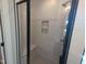 Beautiful shower with a built-in seat and convenient shower niche at 5812 Shawood Dr, Raleigh, NC 27609