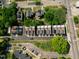Aerial view of modern townhouses showcasing rooftop solar panels, parking and modern landscaping at 600 Rocky Knob Ct, Raleigh, NC 27601