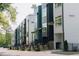 Modern townhomes with a contemporary design and inviting entrances with stairs and landscaping along the street at 600 Rocky Knob Ct, Raleigh, NC 27601