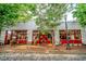 Inviting store front with red trim, large windows, and vintage decor on a charming brick street at 600 Rocky Knob Ct, Raleigh, NC 27601