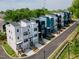 Modern townhomes with inviting entryways, attached garages, and contemporary landscaping along a new street at 600 Rocky Knob Ct, Raleigh, NC 27601