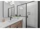 Modern bathroom features a glass shower, contemporary fixtures, and bright subway tiles at 610 Rocky Knob Ct, Raleigh, NC 27601