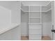 Organized closet with built-in shelving, drawers, and ample storage space at 610 Rocky Knob Ct, Raleigh, NC 27601