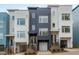 Modern townhome showcasing a sleek facade, multi-pane windows, and attached garages for convenience at 610 Rocky Knob Ct, Raleigh, NC 27601