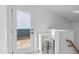 A modern landing area showcases built-in storage and leads to a door opening to the deck at 610 Rocky Knob Ct, Raleigh, NC 27601