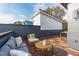 Spacious rooftop deck featuring stylish outdoor furniture and partial views of the neighborhood at 610 Rocky Knob Ct, Raleigh, NC 27601
